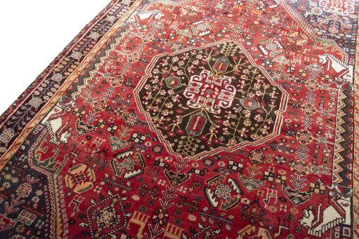 Backside of handmade 2000s Shiraz rug showing knot structure and weave density