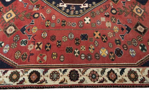 Corner detail of 2000s Shiraz rug showing border pattern and Wool pile