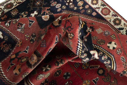 Surface texture of 2000s Shiraz rug with natural Wool and intricate pattern