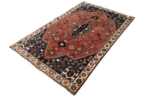 Corner detail of 2000s Shiraz rug showing border pattern and Wool pile