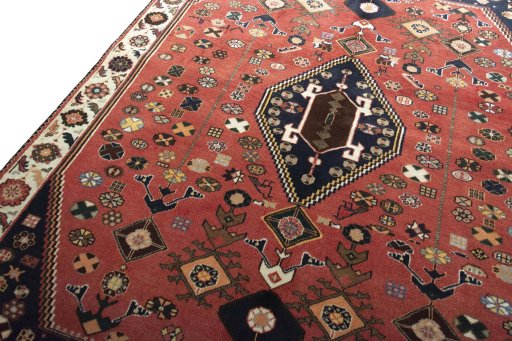 Backside of handmade 2000s Shiraz rug showing knot structure and weave density