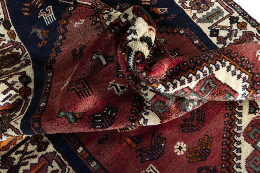 Surface texture of 2000s Shiraz rug with natural Wool and intricate pattern
