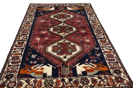 Surface texture of 2000s Shiraz rug with natural Wool and intricate pattern