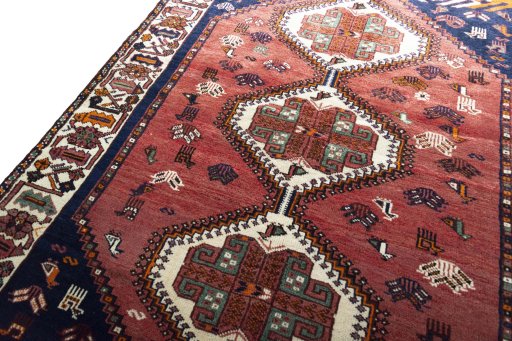 Backside of handmade 2000s Shiraz rug showing knot structure and weave density