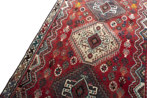 Backside of handmade 2000s Shiraz rug showing knot structure and weave density