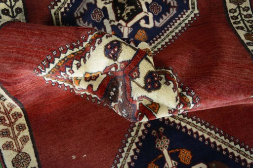 Corner detail of 2000s Shiraz rug showing border pattern and Wool pile