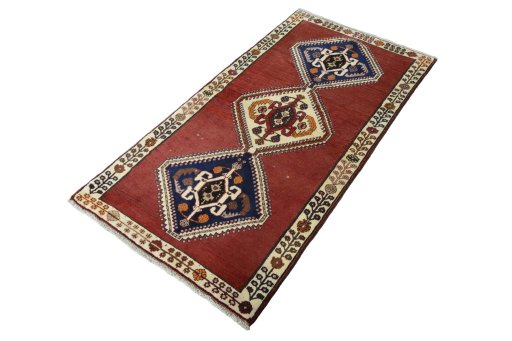 Corner detail of 2000s Shiraz rug showing border pattern and Wool pile