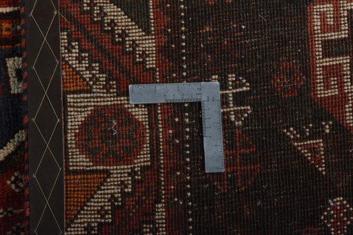 Backside of handmade 2000s Shiraz rug showing knot structure and weave density