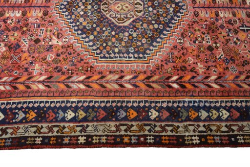 Corner detail of 2000s Shiraz rug showing border pattern and Wool pile