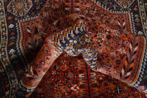 Surface texture of 2000s Shiraz rug with natural Wool and intricate pattern