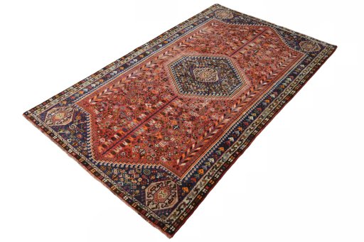 Corner detail of 2000s Shiraz rug showing border pattern and Wool pile