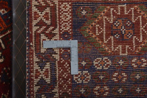 Backside of handmade 2000s Shiraz rug showing knot structure and weave density