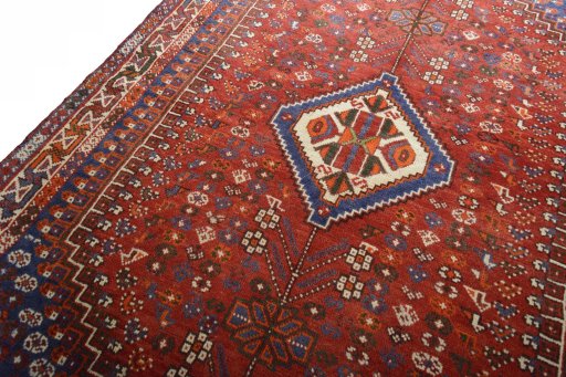 Backside of handmade 2000s Shiraz rug showing knot structure and weave density