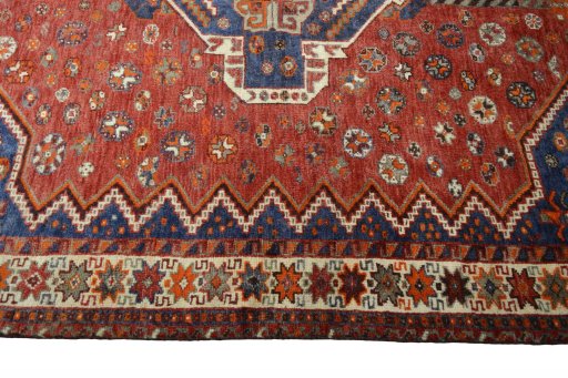 Corner detail of 2000s Shiraz rug showing border pattern and Wool pile