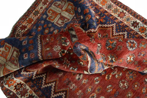 Surface texture of 2000s Shiraz rug with natural Wool and intricate pattern