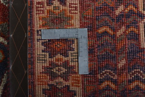 Backside of handmade 2000s Shiraz rug showing knot structure and weave density