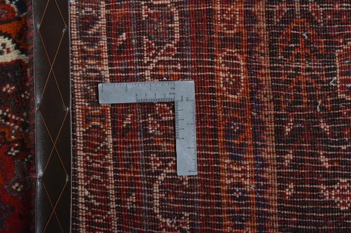 Surface texture of 2000s Shiraz rug with natural Wool and intricate pattern