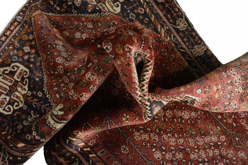Surface texture of 2000s Shiraz rug with natural Wool and intricate pattern