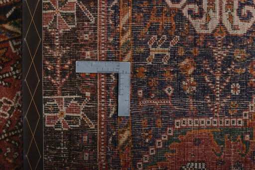 Backside of handmade 2000s Shiraz rug showing knot structure and weave density