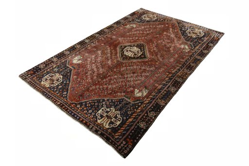 Corner detail of 2000s Shiraz rug showing border pattern and Wool pile