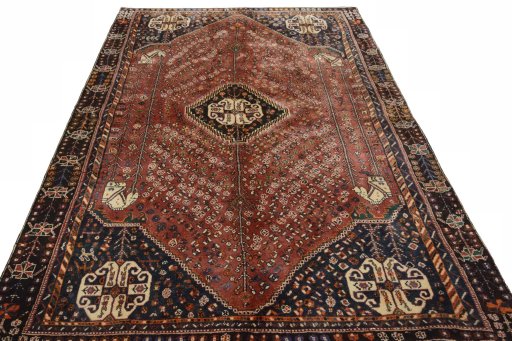 Surface texture of 2000s Shiraz rug with natural Wool and intricate pattern