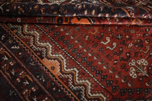 Close-up detail of 2000s Shiraz rug from Iran / Persia showing Wool weave