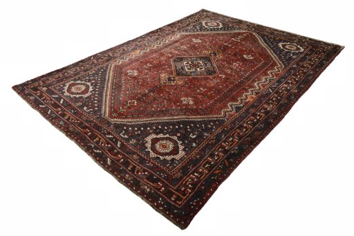 Corner detail of 2000s Shiraz rug showing border pattern and Wool pile