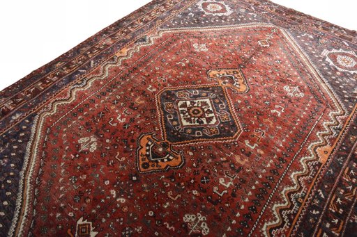 Backside of handmade 2000s Shiraz rug showing knot structure and weave density