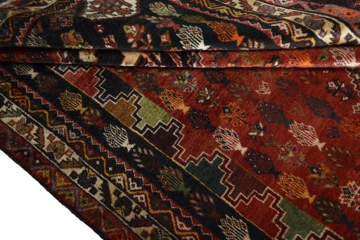 Full view of 2000s Shiraz rug from Iran / Persia, 281 × 173 cm in Red tones