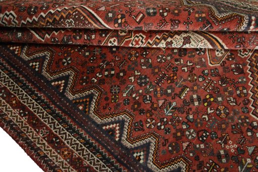 Corner detail of 2000s Shiraz rug showing border pattern and Wool pile