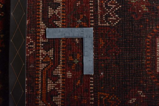 Surface texture of 2000s Shiraz rug with natural Wool and intricate pattern