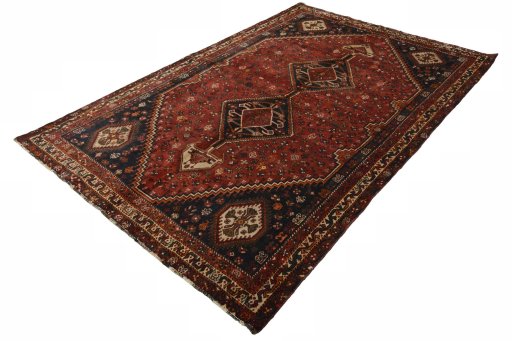 Corner detail of 2000s Shiraz rug showing border pattern and Wool pile