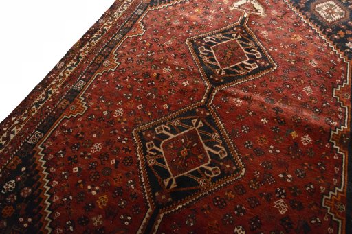 Backside of handmade 2000s Shiraz rug showing knot structure and weave density