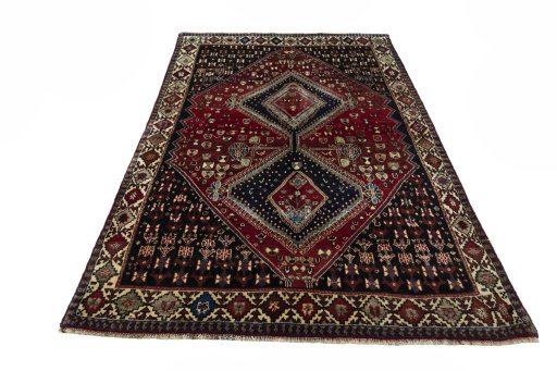 Surface texture of 2000s Shiraz rug with natural Wool and intricate pattern