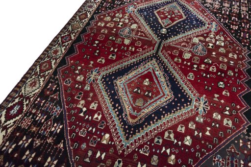 Backside of handmade 2000s Shiraz rug showing knot structure and weave density