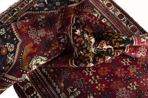 Surface texture of 2000s Shiraz rug with natural Wool and intricate pattern