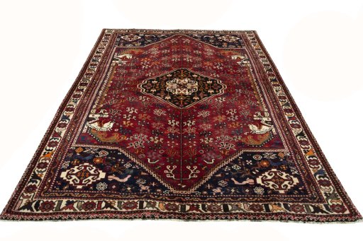 Surface texture of 2000s Shiraz rug with natural Wool and intricate pattern