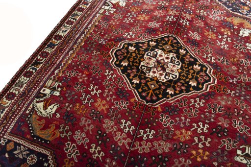 Backside of handmade 2000s Shiraz rug showing knot structure and weave density