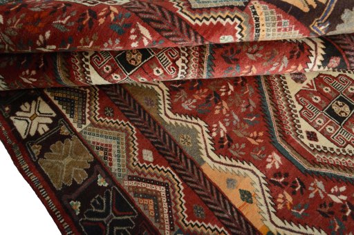 Full view of 2000s Shiraz rug from Iran / Persia, 280 × 170 cm in Red tones