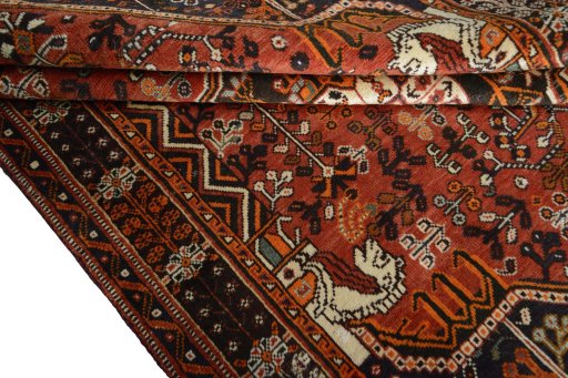 Corner detail of 2000s Shiraz rug showing border pattern and Wool pile