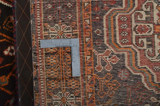 Surface texture of 2000s Shiraz rug with natural Wool and intricate pattern