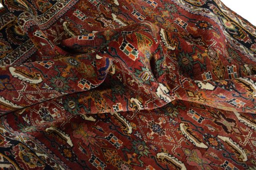 Corner detail of 2000s Shiraz rug showing border pattern and Wool pile