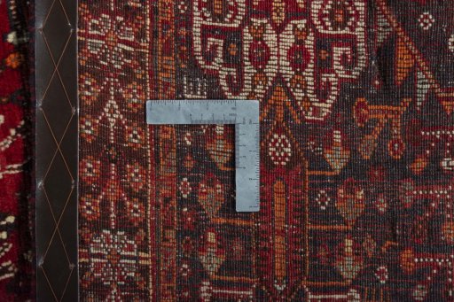 Surface texture of 2000s Shiraz rug with natural Wool and intricate pattern