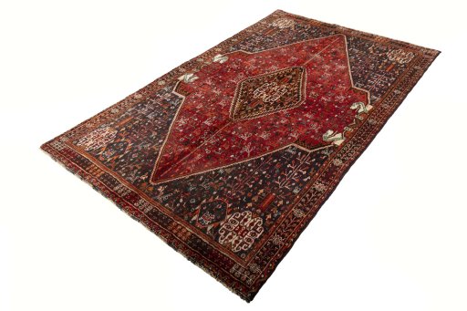 Corner detail of 2000s Shiraz rug showing border pattern and Wool pile