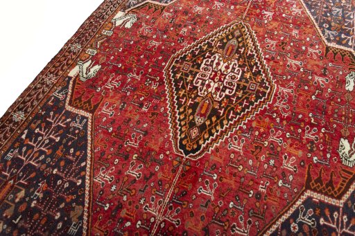 Backside of handmade 2000s Shiraz rug showing knot structure and weave density