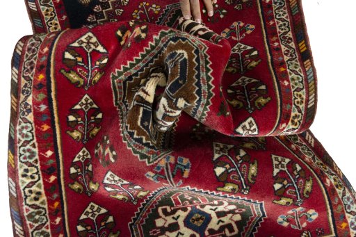 Corner detail of 2000s Shiraz rug showing border pattern and Wool pile