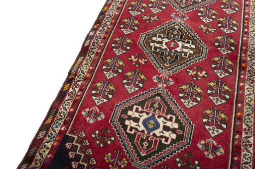 Backside of handmade 2000s Shiraz rug showing knot structure and weave density