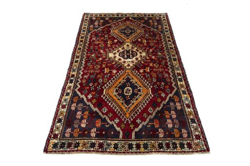 Surface texture of 2000s Shiraz rug with natural Wool and intricate pattern