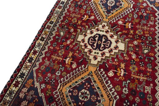 Backside of handmade 2000s Shiraz rug showing knot structure and weave density