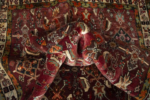 Corner detail of 2000s Shiraz rug showing border pattern and Wool pile